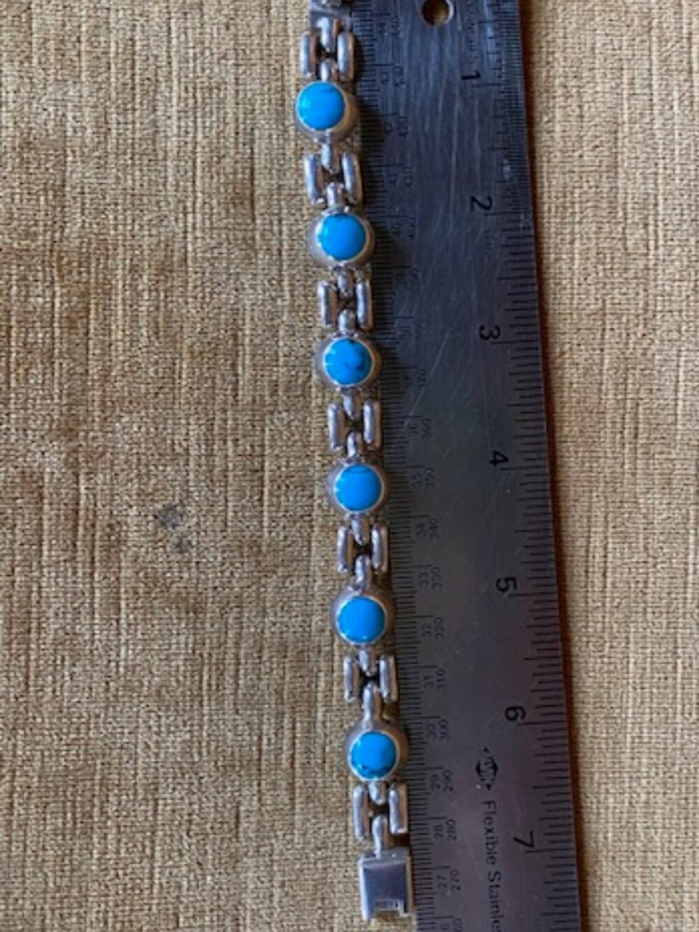 Sterling silver link bracelet with round blue turquoise stones in a Navajo style